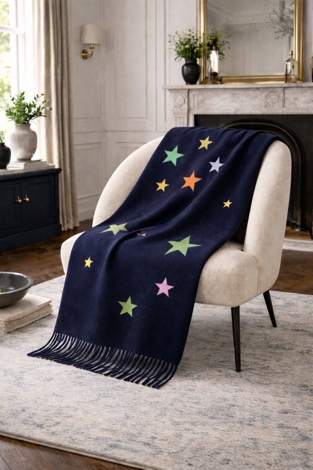 A blanket with a custom celestial motif draped over a chair.